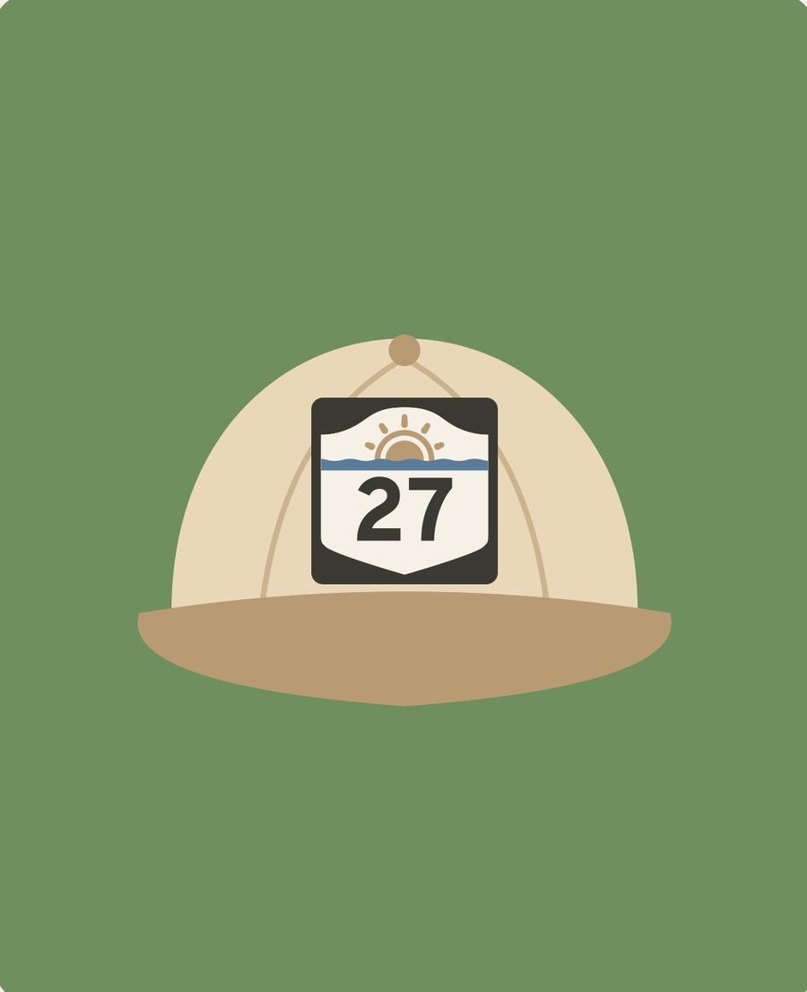 Illustrated mockup of a sand-colored cap with an embroidered Route 27 shield and rising sun, on a sea-grass green background.